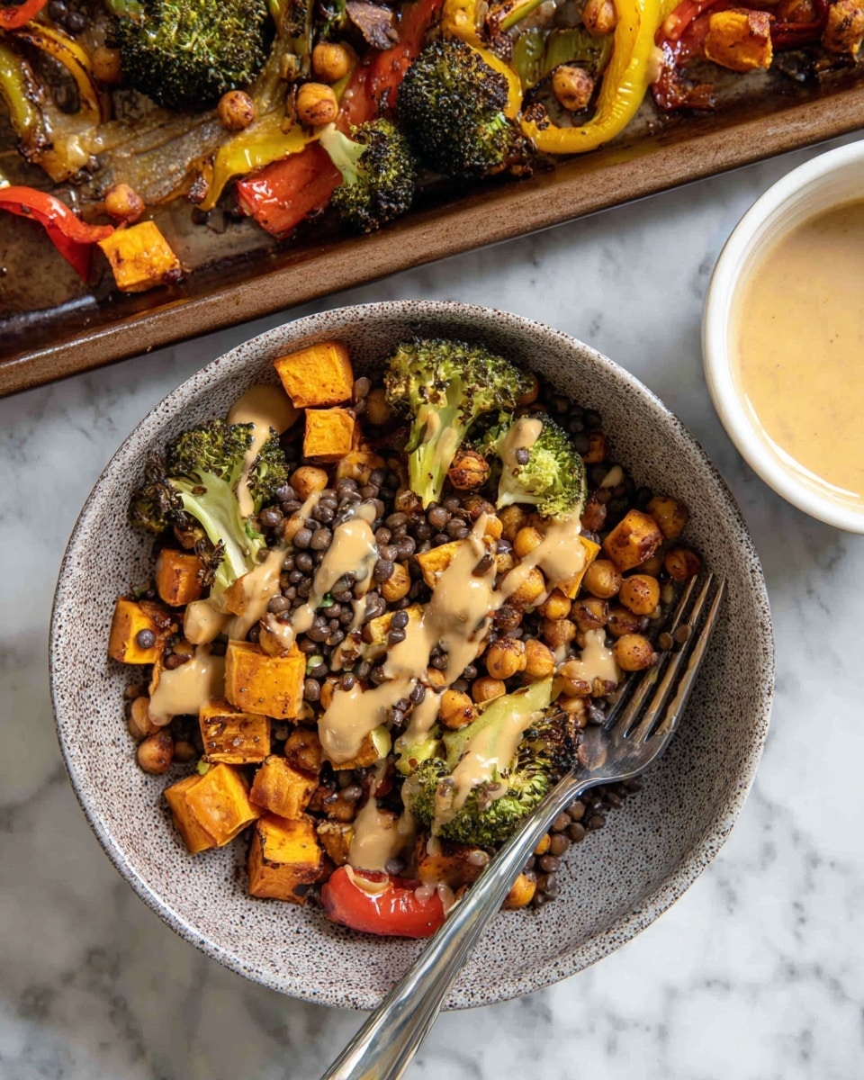 A bowl filled with a colorful mix of roasted vegetables and legumes, including bright orange cubes of sweet potato, green broccoli florets with charred edges, brown chickpeas, black lentils, and slices of yellow and red bell peppers. The dish is drizzled with a creamy beige sauce and contains a silver fork resting inside the bowl. The bowl is placed on a white marbled surface, alongside a baking tray filled with more roasted vegetables and a white bowl containing more creamy sauce. Photo taken with an iphone --ar 4:5 --v 7