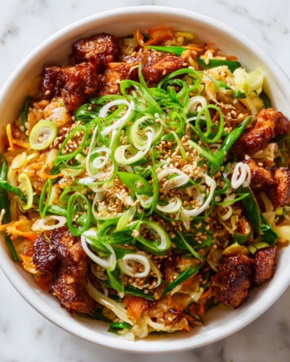A white bowl filled with a colorful dish showing three main layers: the bottom layer consists of small, light beige noodles; the middle layer has browned pieces of tofu or meat with a slightly crispy texture; the top layer is a mix of thinly sliced green onions and small white onion rings, adding freshness and contrast. The dish is sprinkled with light sesame seeds, and the background is a white marbled surface. Photo taken with an iphone --ar 4:5 --v 7
