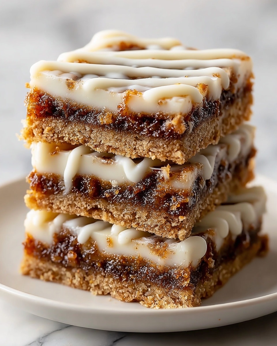 Three square dessert bars are stacked on a white plate set on a white marbled surface. Each bar has three visible layers: the bottom layer is a golden-brown crumbly crust, the middle layer is a dark brown, gooey filling with a textured, slightly chunky appearance, and the top layer is thick, creamy white icing drizzled in diagonal stripes. The sides of the bars show the layers distinctly, with the icing slightly dripping down. Soft natural light highlights the glossy texture of the filling and icing, making the bars look rich and moist. photo taken with an iphone --ar 4:5 --v 7