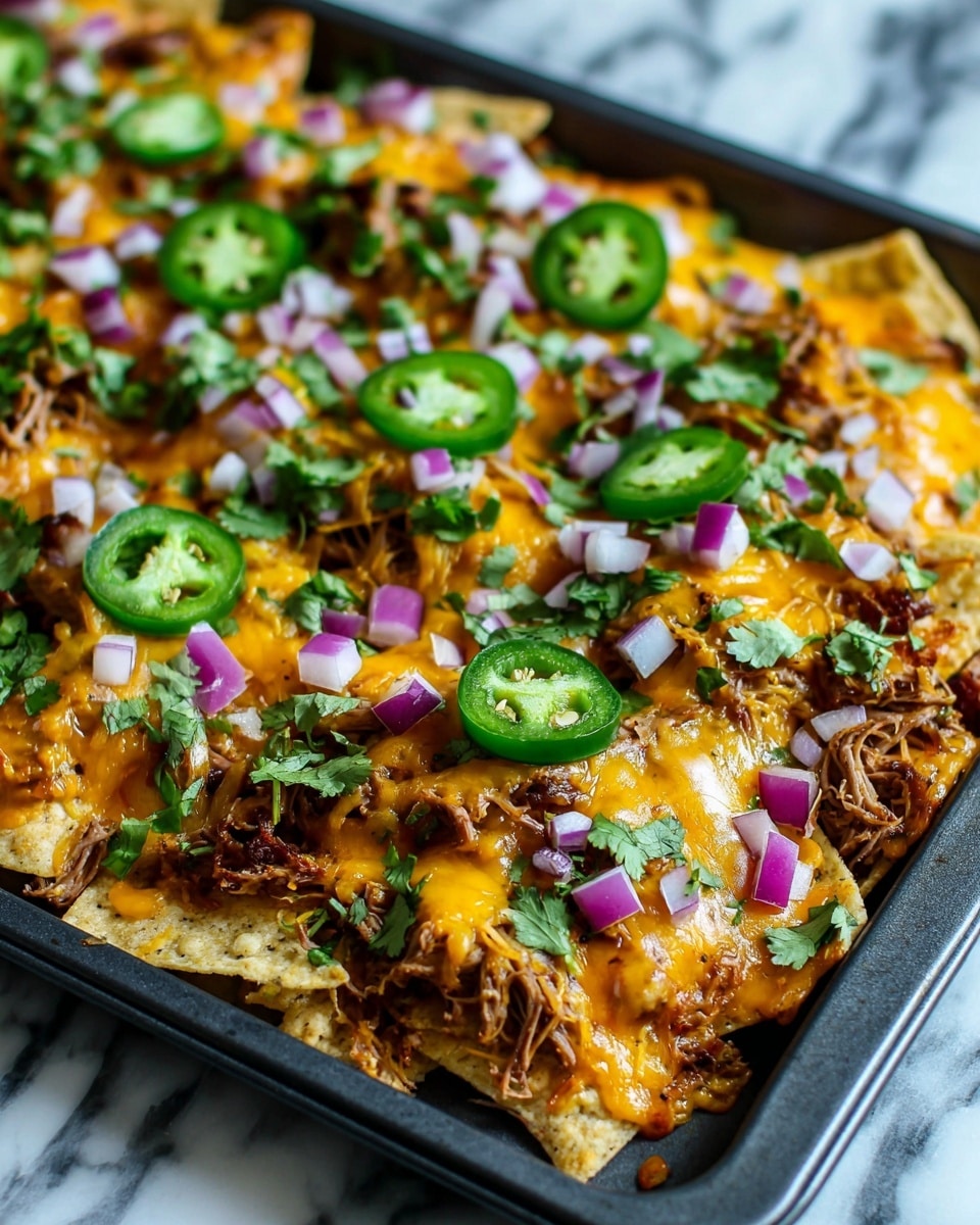 The dish shows one layer of yellow corn tortilla chips spread out on a white marbled surface, topped evenly with melted orange cheddar cheese that covers much of the chips. Over the cheese, there are scattered chunks of brown shredded meat adding texture. Bright green slices of jalapeño peppers are placed on top, along with small pieces of diced purple and white onions. Fresh green cilantro leaves are sprinkled all over, adding a fresh, leafy contrast to the warm colors beneath. The dish is presented in a close-up view showing the mixture of soft melted cheese and crunchy chips, creating a colorful and inviting look. photo taken with an iphone --ar 4:5 --v 7